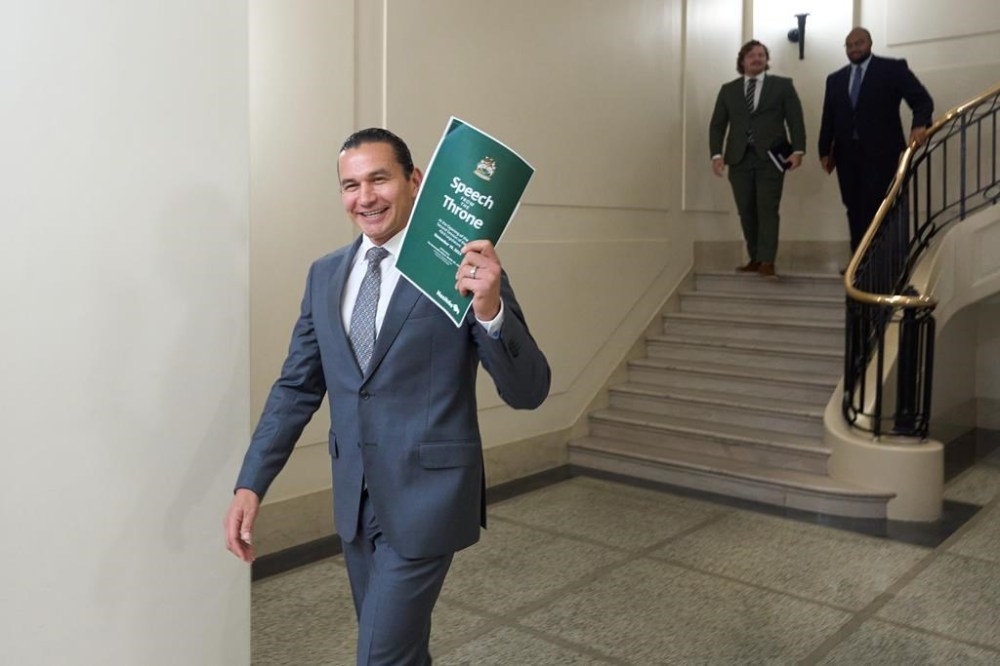 Manitoba Premier Wab Kinew walks into the media room to speak to the press ahead of the Speech from the Throne at the Manitoba Legislative Building in Winnipeg, Tuesday, Nov. 19, 2024. Security at the Manitoba legislature has increased since the start of the COVID-19 pandemic. THE CANADIAN PRESS/David Lipnowski
