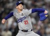 FILE - Los Angeles Dodgers pitcher Walker Buehler throws against the New York Yankees during the ninth inning in Game 5 of the baseball World Series, Oct. 30, 2024, in New York. (AP Photo/Ashley Landis, File)