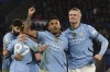 Manchester City's Erling Haaland, right, celebrates with Manchester City's Savinho after scoring his side's second goal during the English Premier League soccer match between Leicester City and Manchester City at King Power stadium in Leicester, England, Sunday, Dec. 29, 2024. (AP Photo/Rui Vieira)