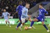 Manchester City's Erling Haaland, center, duels for the ball with Leicester's Harry Winks during the English Premier League soccer match between Leicester City and Manchester City at King Power stadium in Leicester, England, Sunday, Dec. 29, 2024. (AP Photo/Rui Vieira)