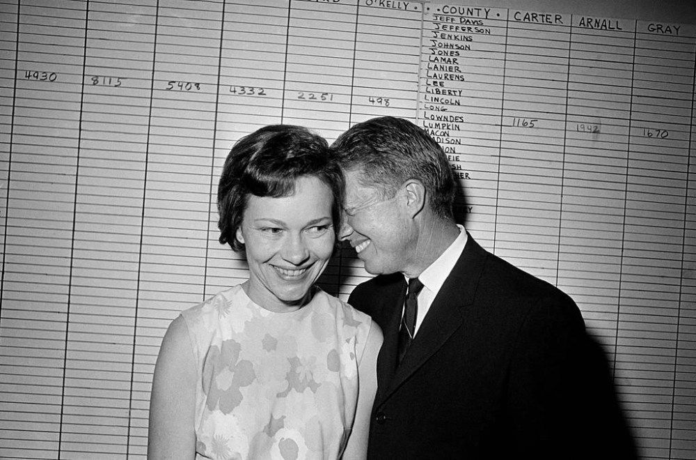 FILE - Georgia state Sen. Jimmy Carter hugs his wife, Rosalynn, at his Atlanta campaign headquarters, Sept. 15, 1966. (AP Photo, File)