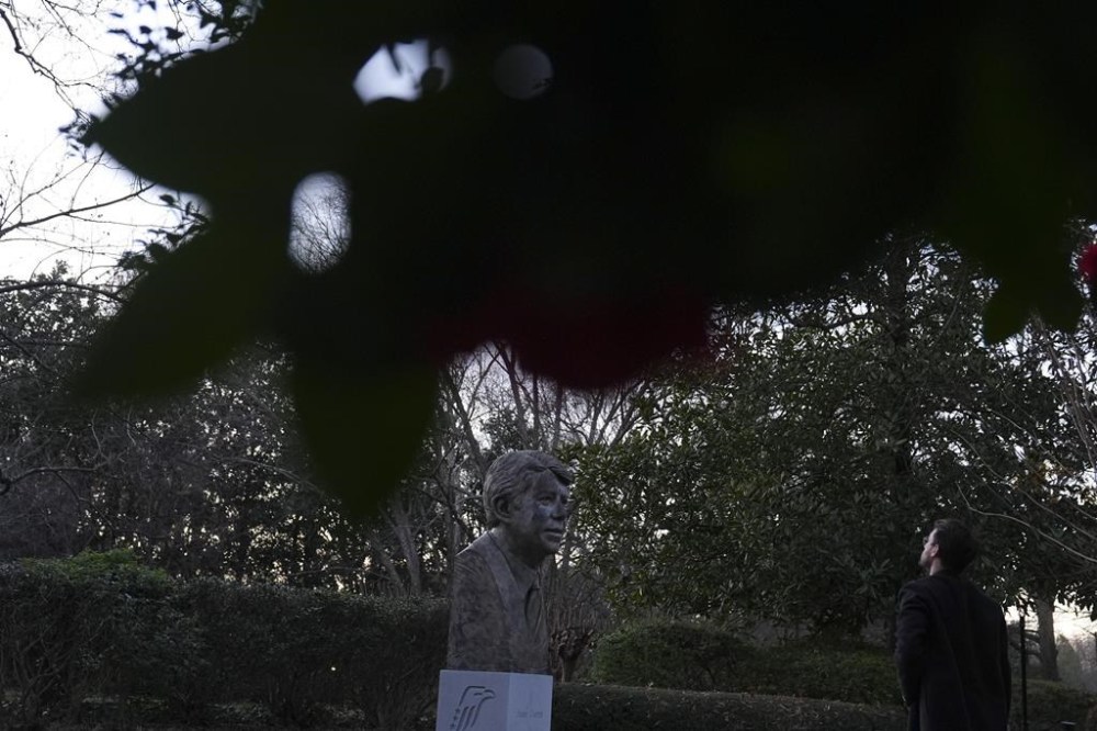 A person visits a bust of former President Jimmy Carter at the Jimmy Carter Presidential Library and Museum on Sunday, Dec. 29, 2024, in Atlanta. (AP Photo/Brynn Anderson)