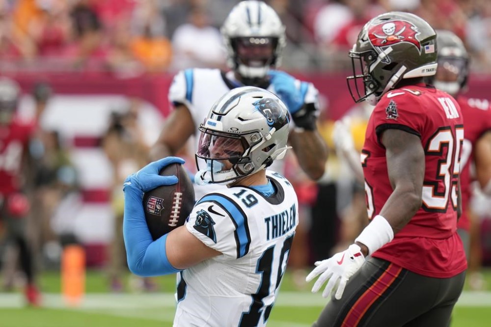Carolina Panthers wide receiver Adam Thielen catches a touchdown pass against the Tampa Bay Buccaneers during the first half of an NFL football game Sunday, Dec. 29, 2024, in Tampa, Fla. (AP Photo/Chris O'Meara)