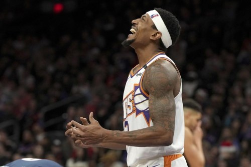 Phoenix Suns guard Bradley Beal reacts after scoring against the Denver Nuggets during the second half of an NBA basketball game, Wednesday, Dec. 25, 2024, in Phoenix. Phoenix won 110-100. (AP Photo/Rick Scuteri)