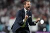 FILE - England's manager Gareth Southgate celebrates after winning the Euro 2020 soccer championship semifinal match against Denmark at Wembley stadium in London, Wednesday, July 7, 2021. (AP Photo/Frank Augstein, Pool, File)