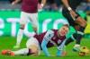 FILE - West Ham's Jarrod Bowen falls on the ground during the English Premier League soccer match between West Ham United and Liverpool at the London Stadium in London, Sunday, Dec. 29, 2024. (AP Photo/Kirsty Wigglesworth, File)