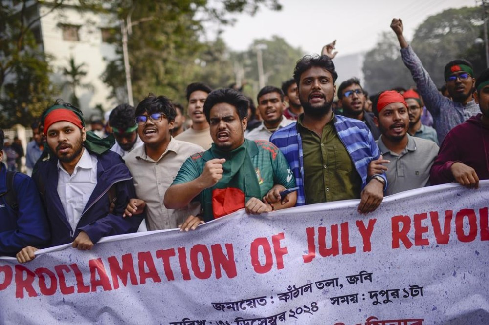 Participants, mostly students, shout slogans during