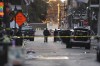 Emergency services attend the scene after a vehicle drove into a crowd on New Orleans' Canal and Bourbon Street, Wednesday Jan. 1, 2025. (AP Photo/Gerald Herbert)