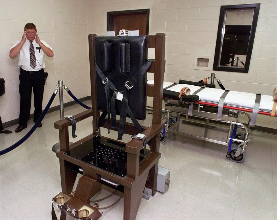 FILE - Ricky Bell, warden at Riverbend Maximum Security Institution, gives a tour of the prison's execution chamber in Nashville, Tenn., Oct. 13, 1999. (AP Photo/Mark Humphrey, File)