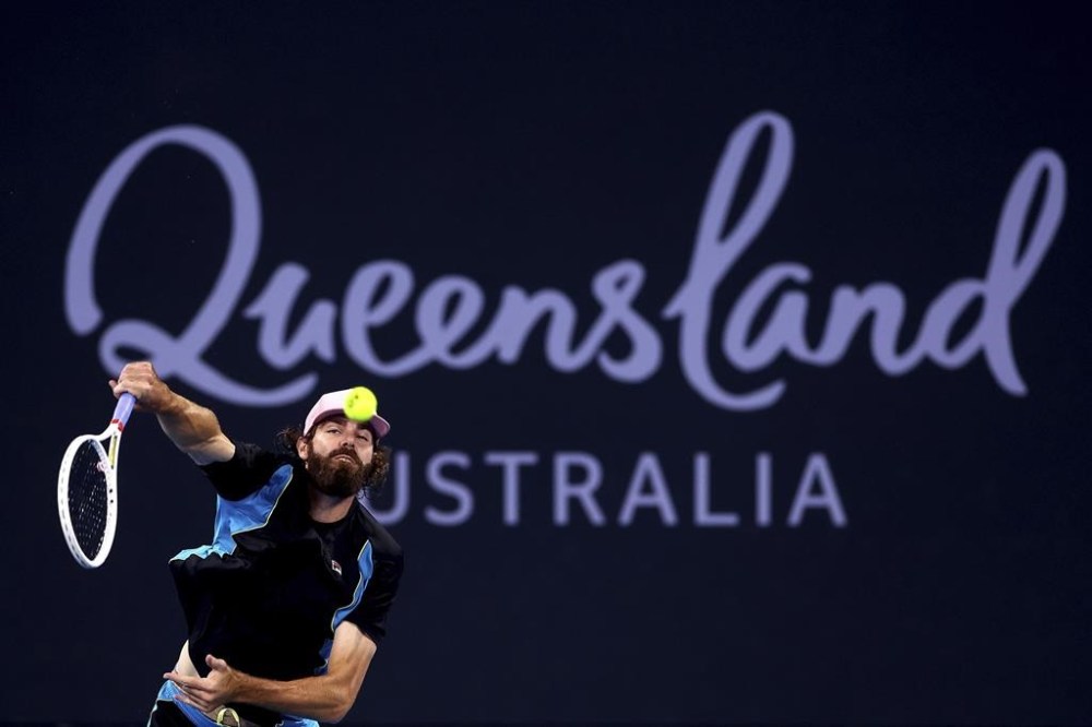 USA's Reilly Opelka plays serves to Serbia's Novak Djokovic during their match at the Brisbane International, in Brisbane, Australia, Friday, Jan. 3, 2025. (AP Photo/Pat Hoelscher)