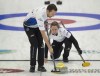 Rachel Homan and playing partner Brendan Bottcher compete against Jessica Zheng and Victor Pietrangelo during draw 5 action against at the Canadian mixed doubles curling trials in Liverpool, N.S. on Tuesday, Dec.31, 2024. THE CANADIAN PRESS/HO-Michael Burns Photo
