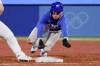 FILE - South Korea's Hyeseong Kim beats a tag by United States' Triston Casas in a pickoff-attempt at first base during the fifth inning of a baseball game at the 2020 Summer Olympics, July 31, 2021, in Yokohama, Japan. (AP Photo/Sue Ogrocki, File)