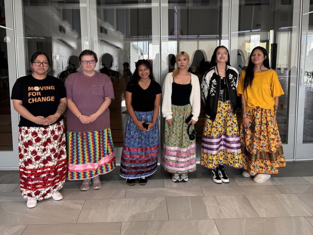 A group of Indigenous youth pose wearing the ribbon skirts they made with Growing Youth Movers at the mâmawêyatitân centre in Regina in this undated handout photo.. The organization has been working since the fall on creating a ribbon skirt regalia library for youth to borrow ribbon skirts and shirts to wear at ceremonies. THE CANADIAN PRESS/HO - Claire Tuckanow