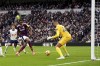 Newcastle United's Alexander Isak score past Tottenham's Brandon Austin during the English Premier League soccer match between Tottenham Hotspur and Newcastle United at the Tottenham Hotspur Stadium, London, Saturday Jan. 4, 2025. (John Walton/PA via AP)