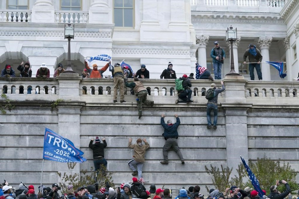 Supporters of then-President Donald Trump storm the Capitol in Washington, Jan. 6, 2021. (AP Photo/John Minchillo, File)