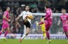 Fulham's Raul Jimenez, left, and Ipswich Town's Nathan Broadhead fight for the ball during the English Premier League soccer match between Fulham and Ipswich Town at Craven Cottage stadium, London, Sunday Jan. 5, 2025. (Andrew Matthews/PA via AP)