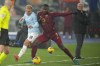 Roma's Evan Ndicka, right, duels for the ball with Lazio's Gustav Isaksen during a Serie A soccer match between Roma and Lazio, at the Stadio Olimpico in Rome, Italy, Sunday, Jan. 5, 2025. (AP Photo/Alessandra Tarantino)