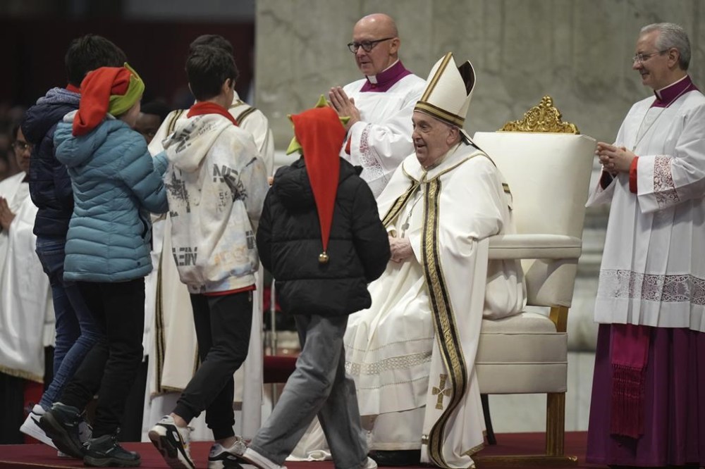 Children bring the offertory during an Epiphany mass presided by Pope Francis in St.Peter's Basilica, at the Vatican, Monday, Jan. 6, 2025. (AP Photo/Alessandra Tarantino)