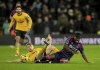Wolverhampton Wanderers' Tommy Doyle, left, fouls Nottingham Forest's Anthony Elanga during the Premier League match at Molineux Stadium, Wolverhampton, England, Monday Jan. 6, 2025. (Mike Egerton/PA via AP)