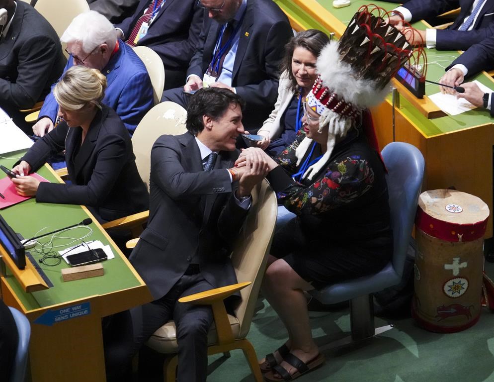 Prime Minister Justin Trudeau shakes hands with Assembly of First Nations National Chief Cindy Woodhouse Nepinak as they attend the opening of the 79th Session of the UN General Assembly at United Nations headquarters, Tuesday, Sept. 24, 2024. THE CANADIAN PRESS/Sean Kilpatrick