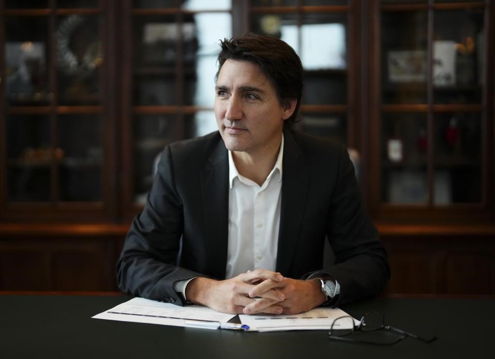Prime Minister Justin Trudeau poses for a portrait at the Office of the Prime Minister and Privy Council in Ottawa, Monday, Dec. 11, 2023. THE CANADIAN PRESS/Sean Kilpatrick