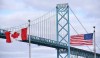 The Ontario government says it has launched an enhanced security operation intended to beef up security along the border with the United States.Canadian and American flags fly near the Ambassador Bridge at the Canada-USA border crossing in Windsor, Ont. on Saturday, March 21, 2020. THE CANADIAN PRESS/Rob Gurdebeke