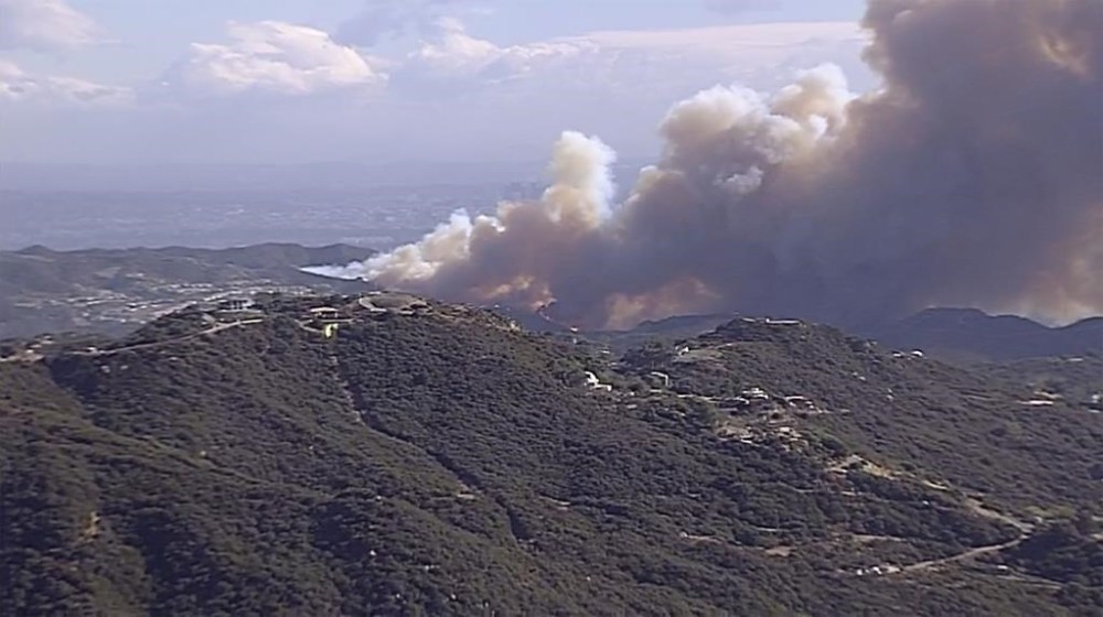 Smoke fills the air from a Los Angeles County brush fire with high winds in Saddle Peak, Calif., on Tuesday, Jan. 7, 2025. (ABC7 Los Angeles via AP)