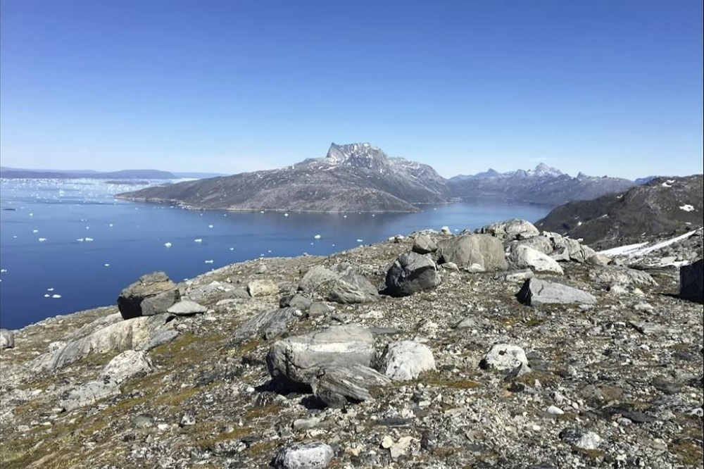 FILE - Small pieces of ice float in the water in Nuuk Fjord, Greenland, on June 15, 2019. (AP Photo/Keith Virgo, File)