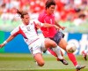 FILE - U.S. player Jeff Agoos challenges South Korea's Ki Hyeon Seol, right, during a 2002 World Cup Group D soccer match in Daegu, South Korea, June 10, 2002. (AP Photo/Tony Gutierrez)