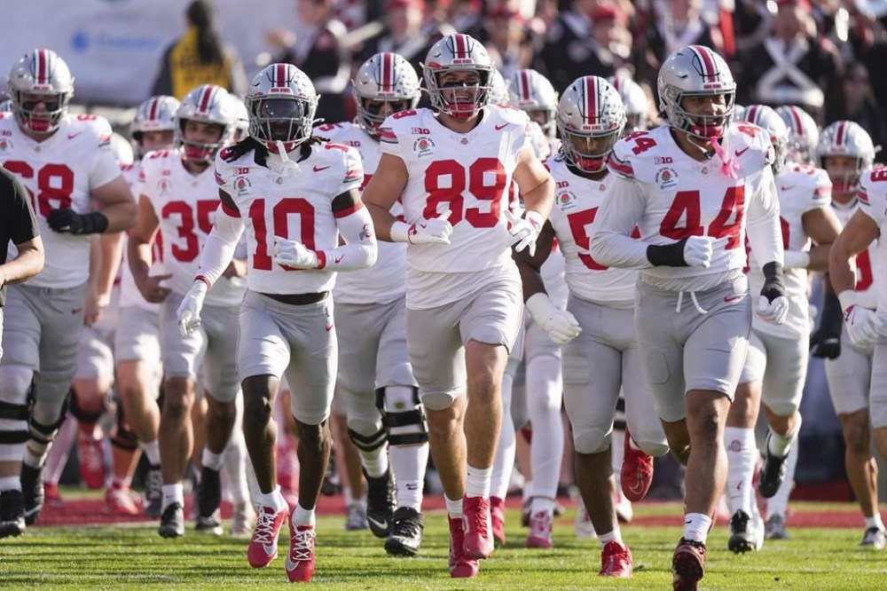Ohio State players take to the field before the Rose Bowl College Football Playoff against Oregon, Wednesday, Jan. 1, 2025, in Pasadena, Calif. (AP Photo/Mark J. Terrill)