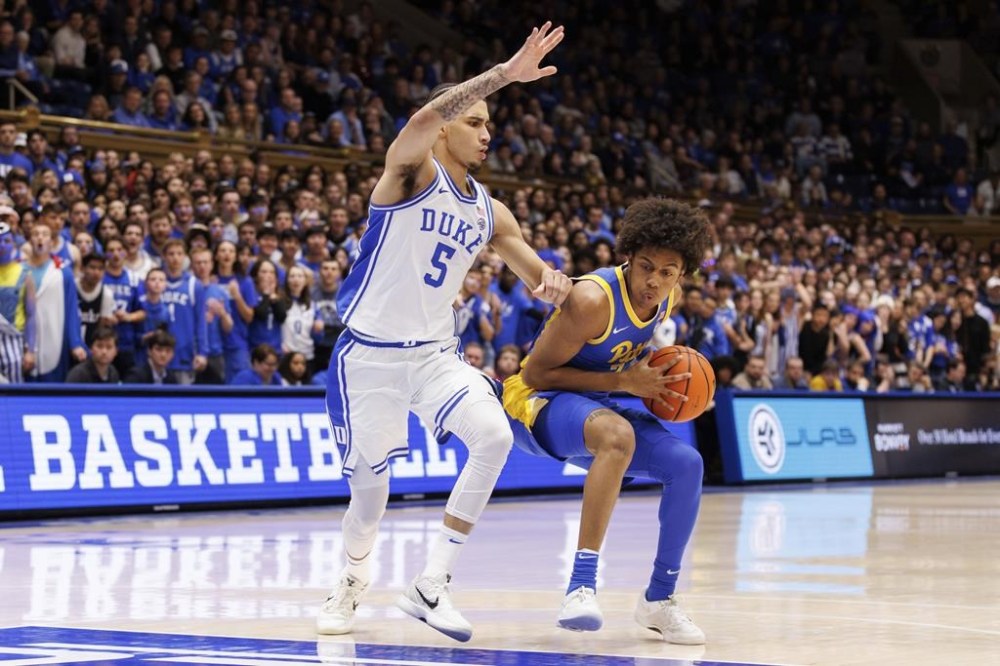 Pittsburgh's Brandin Cummings drives against Duke's Tyrese Proctor (5) during the first half of an NCAA college basketball game in Durham, N.C., Tuesday, Jan. 7, 2025. (AP Photo/Ben McKeown)