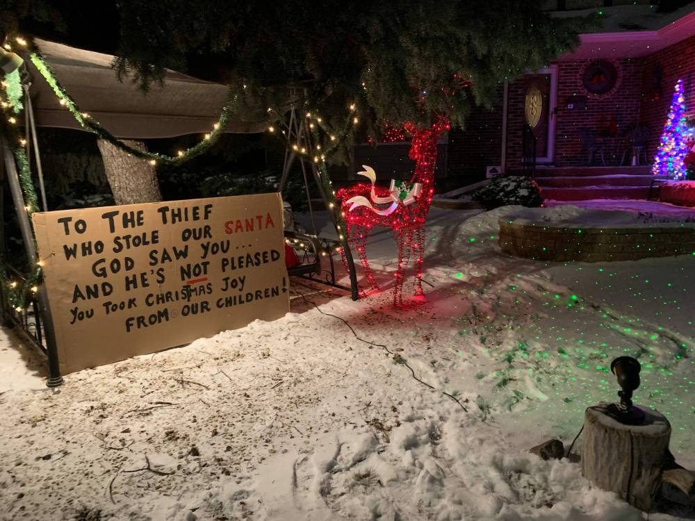 LARRY BREDESEN PHOTO
Sherrie Bredesen’s sign reads: ‘To the thief who stole our Santa, God saw you… and he’s not pleased. You took Christmas joy from our children!’