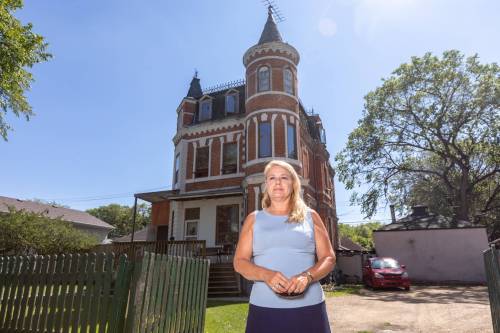 SASHA SEFTER / FREE PRESS FILES
                                Executive Director of Heritage Winnipeg Cindy Tugwell stands in-front of 494 College Avenue, a property which under the city&rsquo;s Historical Resources bylaw has been listed on the &ldquo;commemorative list&rdquo; but is not safe from demolition or renovation. 190724 - Wednesday, July 24, 2019.