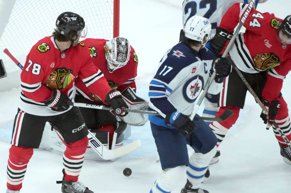 CHARLES REX ARBOGAST / THE ASSOCIATED PRESS
Chicago Blackhawks goaltender Arvid Soderblom makes a save in traffic during the second period of an NHL game against the Winnipeg Jets on Saturday, Dec. 7, 2024, in Chicago.