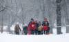 JOHN WOODS / FREE PRESS
                                Runners from the City Park Runners club, some wearing their Christmas sweaters, make their way down Wellington Crescent as heavy snowfall begins Sunday.