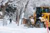 MIKE DEAL / FREE PRESS
                                Residents of St. Norbert start to dig out their driveways Monday morning.