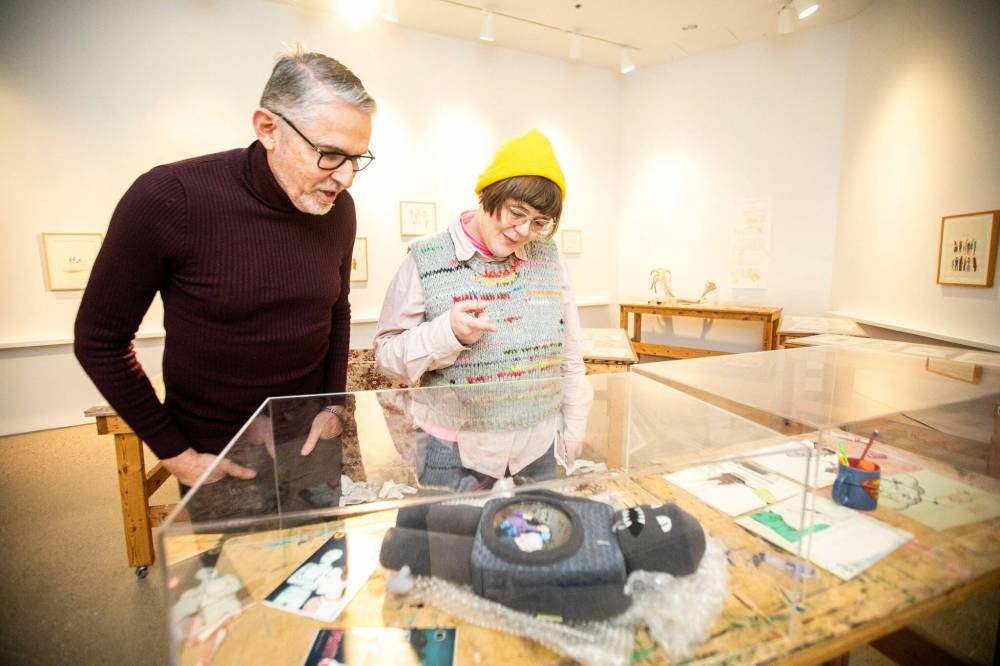 MIKAELA MACKENZIE / FREE PRESS Oliver Botar, professor of art history and associate director of the School of Art at the University of Manitoba (left), and Blair Fornwald, director and curator of the School of Art gallery at the University of Manitoba, in the new Royal Art Lodge exhibit at the university gallery on Friday, Dec. 6, 2024. For Martin Zeilig story. Winnipeg Free Press 2024