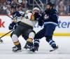 John Woods / THE CANADIAN PRESS
                                Winnipeg Jets’ Mason Appleton (22) defends against Vegas Golden Knights’ Victor Olofsson (95) during second period NHL action in Winnipeg, Thursday, Dec. 12, 2024.