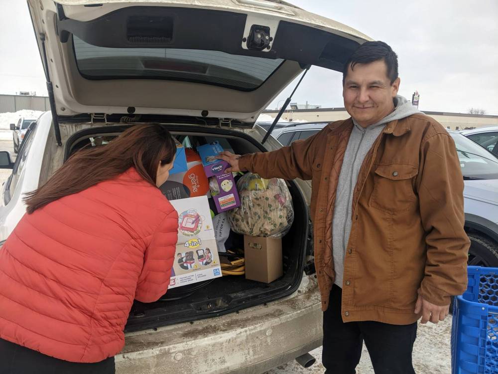 Bruce and Amber Kakewash waited until the GST holiday took effect Saturday to buy Christmas presents for their children. (Chris Kitching / Free Press)