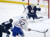 Winnipeg Jets goaltender Connor Hellebuyck (37) saves the shot from Montreal Canadiens’ Patrik Laine (92) during first period NHL action in Winnipeg, Saturday, Dec. 14, 2024. (John Woods / The Canadian Press files)