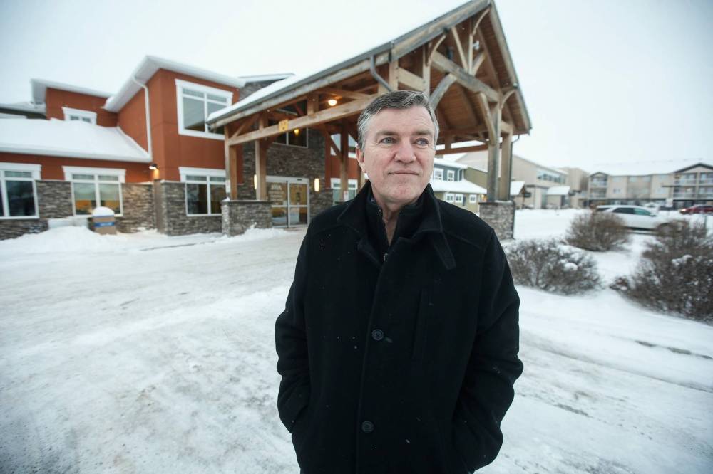 JOHN WOODS / FREE PRESS
                                Niverville mayor Myron Dyck outside the Heritage Centre, which acts as a community hub that includes a seniors living centre, daycare, medical and dental clinics and other spaces.