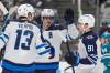 Tony Avelar / The Associated Press
                                Winnipeg Jets’ Mark Scheifele, centre, celebrates his power play goal against the San Jose Sharks with teammates Gabriel Vilardi and Cole Perfetti in the second period.