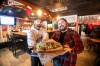 MIKAELA MACKENZIE / FREE PRESS
                                Kowalski and Bielak with an Uncle Paulie sandwich at the Handsome Daughter. The South Osborne sandwich shop has expanded into The Handsome Daughter on Sherbrook Street.
