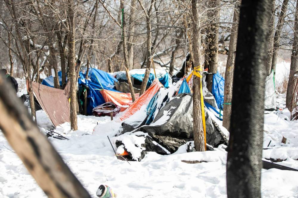 MIKAELA MACKENZIE / FREE PRESS
Along Waterfront Drive, people living at an encampment by the river and in nearby homes had mixed reactions to hearing about the premier's plan.