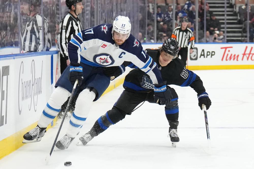 NATHAN DENETTE / THE CANADIAN PRESS FILES
Jets captain Adam Lowry and his teammates look to pick up where they left off before the Christmas break which they entered on a two-game winning streak.