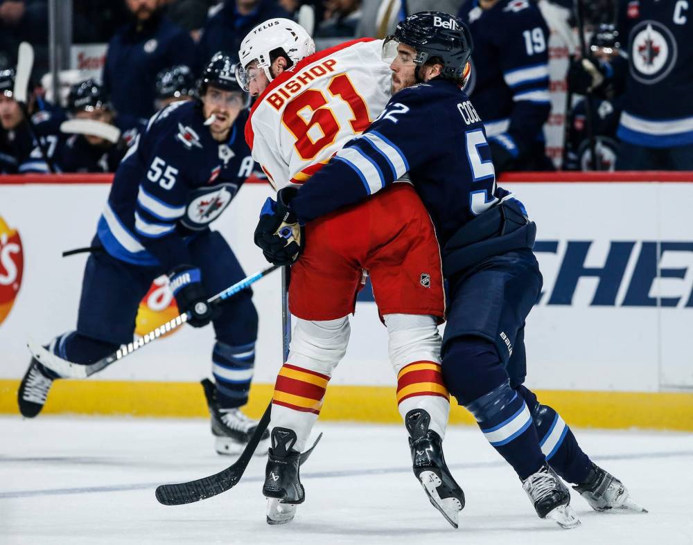 JOHN WOODS / THE CANADIAN PRESS FILES
Dylan Coghlan (right) is back with the Jets after a brief spell with the Manitoba Moose.