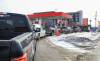 RUTH BONNEVILLE / FREE PRESS
                                Motorists line up for gas at 204 Gas on Sargent and King Edward Street on the day before the provincial gas tax is re-instated.
