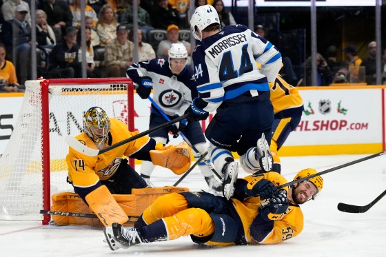 Winnipeg Jets' Josh Morrissey (44) jumps over a sliding Nashville Predators' Roman Josi (59) during the Nov. 23 game. The Jets lost that game, but the Predators have been struggling as of late. (Mark Humphrey / The Associated Press files)