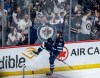 Winnipeg Jets' Nikita Chibrikov (90) celebrates his game-winning goal against the Vancouver Canucks during third period NHL action in Winnipeg on Thursday, April 18, 2024. THE CANADIAN PRESS/John Woods