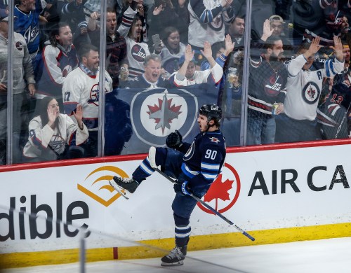 Winnipeg Jets' Nikita Chibrikov (90) celebrates his game-winning goal against the Vancouver Canucks during third period NHL action in Winnipeg on Thursday, April 18, 2024. THE CANADIAN PRESS/John Woods